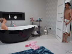 Steamy blonde MILF lets her stepson join the fun after spying on her