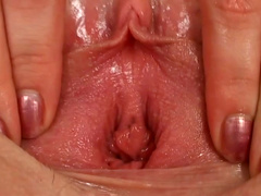 Playful blonde teen fists her shaved stretched pussy