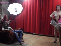 Bubbly MILF dances with assistants